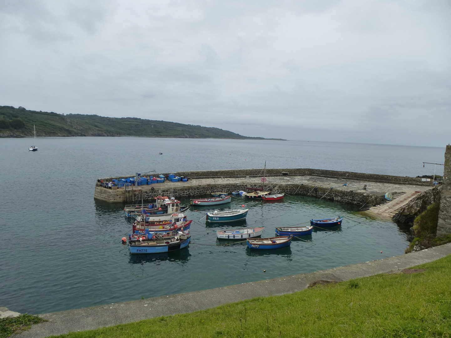 Fishing scene with several boats in a small port