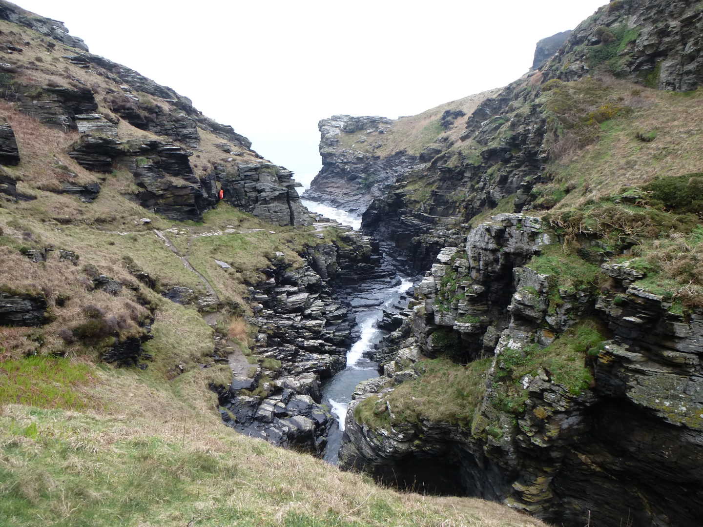 A view of a rocky valley with the sea at the bottom